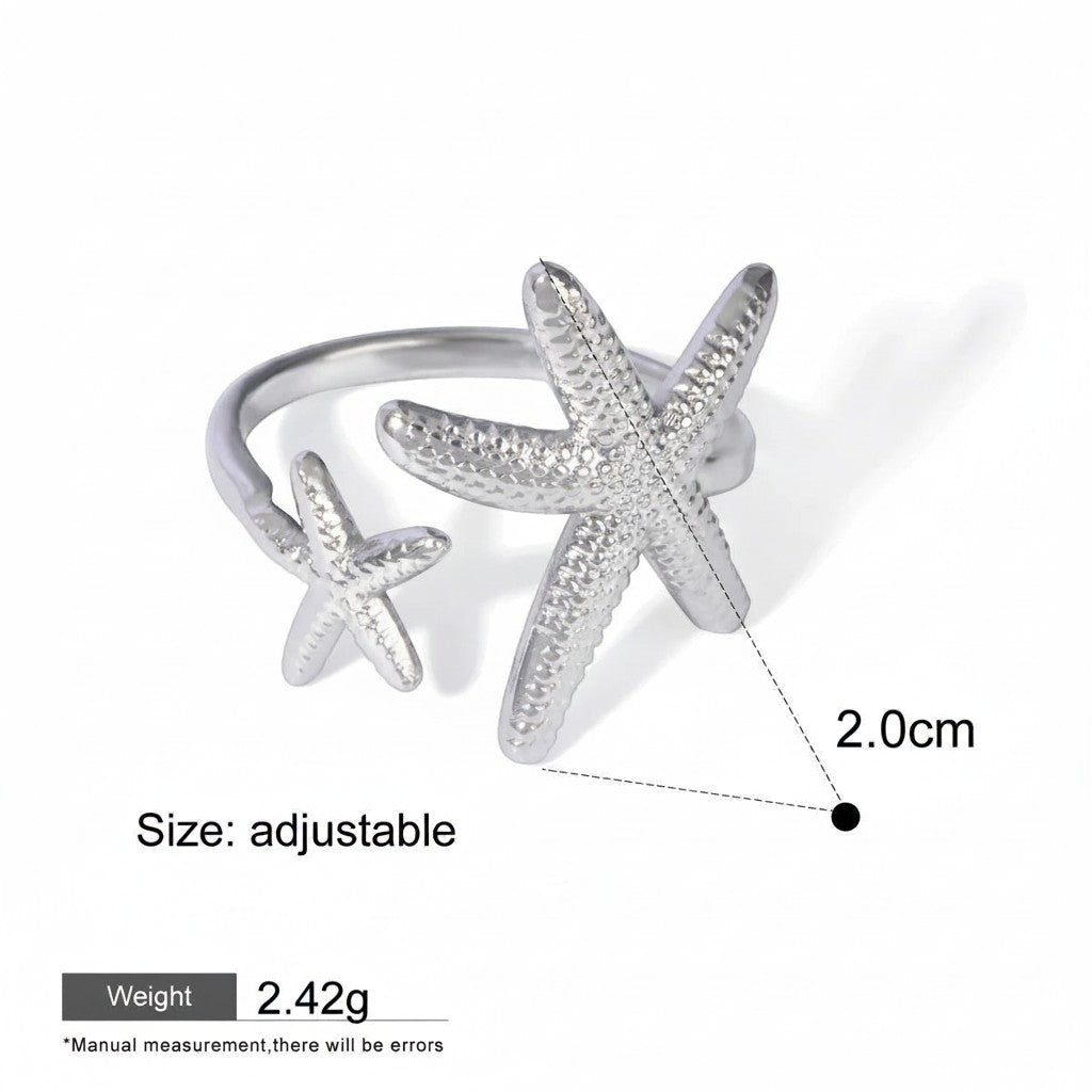 Seraphina Treasures silver open ring with two textured starfish, one large and one small, adjustable size.
